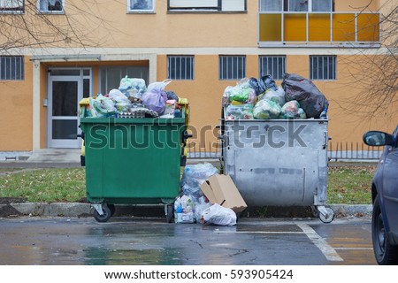 Dumpsters being full with garbage