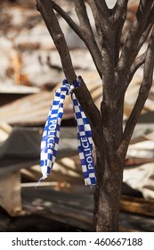 Dunalley, Australia-February 3, 2013. Tasmanian Police Services Tape Attached To A Tree After A Bushfire Has Destroyed Homes, Dunalley, Tasmania, Australia