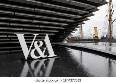 DUNDEE, SCOTLAND - AUGUST 11, 2019: The logo of V and A Art Design Museum in Dundee, Scotland with a water pool in front of it