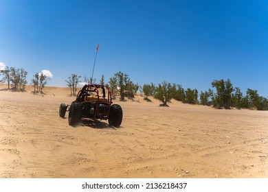 Dune Buggy Driving Through Sand Dunes