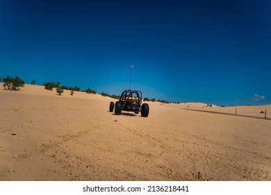 Dune Buggy Driving Through Sand Dunes