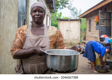 DUNGA, KENYA - SEPTEMBER 20, 2021: Kenyan cook Rehema Ali sells fish-based meals on the shores of Lake Victoria, the world's largest tropical freshwater lake.