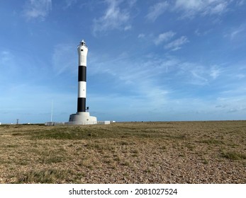 Dungeness, Kent, UK- 03.20.2021:  Dungeness Lighthouse on the Dungeness Headland started operation on 20 November 1961. Its construction was due the building of Dungeness nuclear power station