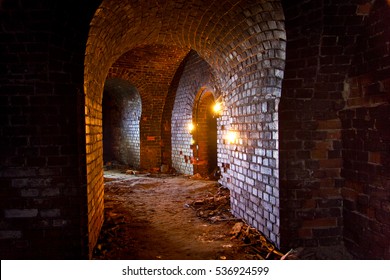 Dungeon Under The Old German Fortress Illuminated By Lantern And Candles