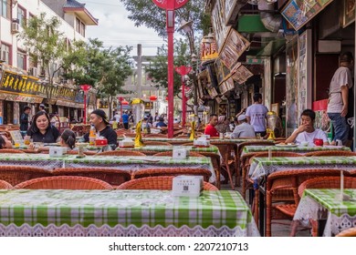 DUNHUANG, CHINA - AUGUST 19, 2018: Open Air Restaurants In Dunhuang, Gansu Province, China