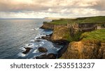 Dunluce Castle in Northern Ireland aerial view - An aerial view capturing the stunning historical ruins, beautifully set against a picturesque coastal landscape