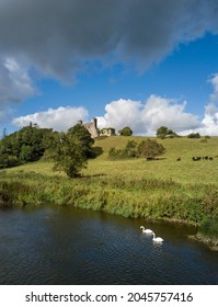 Dunmoe castle aerial view with swans on river Boyne in the foreground. Navan, Co. Meath, Ireland. September 19, 2021