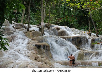 Dunn's River Falls, Jamaica. A Couple Under The Waterfall
