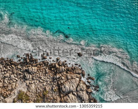 Similar – Aerial Drone View Of Dramatic Ocean Waves Crushing On Rocky Landscape