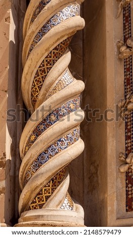 Duomo di Orvieto. A close-up of the spiral column adorned with geometric mosaic on the facade of the cathedral, cosmati technique. The famous Cathedral of Santa Maria Assunta Orvieto, Umbria, Terni