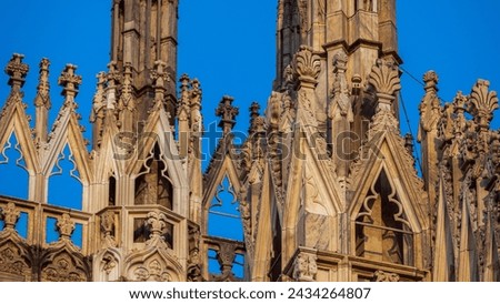 Duomo of Milano close-up with a blue sky in the background, Italy