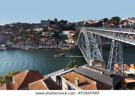 Similar – Blonde woman looks at bridge in Porto