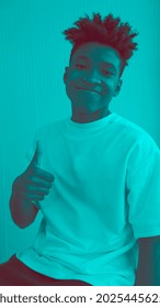 Duotone Or Half Tone Portrait Of Young African American Man In Studio Looking At Camera