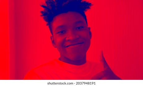 Duotone Or Half Tone Portrait Of Young African American Man In Studio Looking At Camera