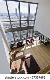 duplex apartment with two floors large windows and city views
