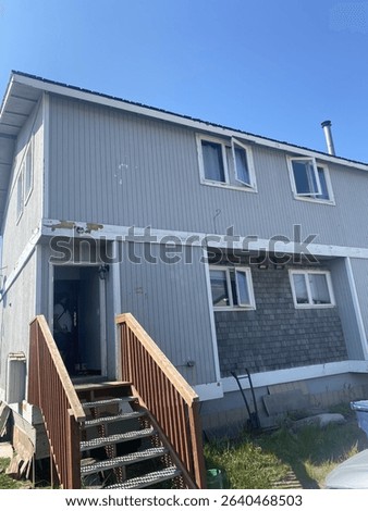 Duplex house windows open in summer