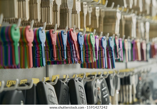 duplicates of keys of car and\
house in the wall of a locksmith\'s shop to be able to make the\
copies