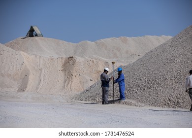 Duqm, Oman - December 29 2018 : Workers in Quarry Measuring and waiting for transportation 