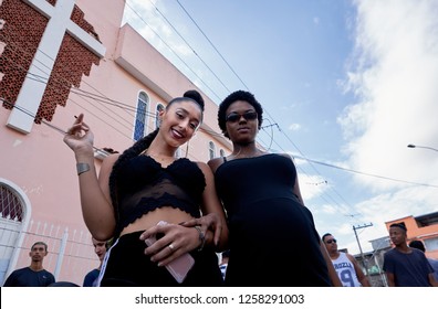 Duque De Caxias, RJ, Brazil, Dec, 2018: Two Pretty Young Women In Black Smoking A Joint In Front Of Church Transgression 