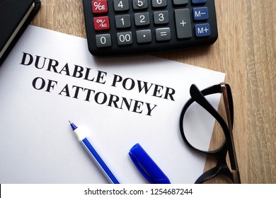 Durable Power Of Attorney Document, Pen, Glasses And Calculator On Desk