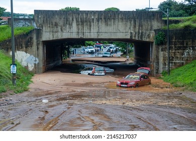 Durban, South Africa, 12 April 2022. Abandoned cars lie in the mud and water underneath a bridge after heavy rains bought severe flash floods to the area.