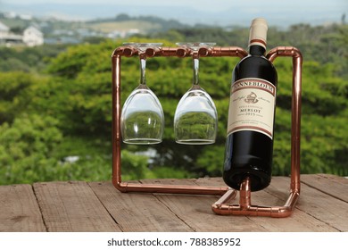 DURBAN, SOUTH AFRICA - 20 MAY 2017: A bottle of La Motte wine on a copper stand. South Africa produces around 10 million hL a year, putting the country in the top 10 global wine producers. Editorial.