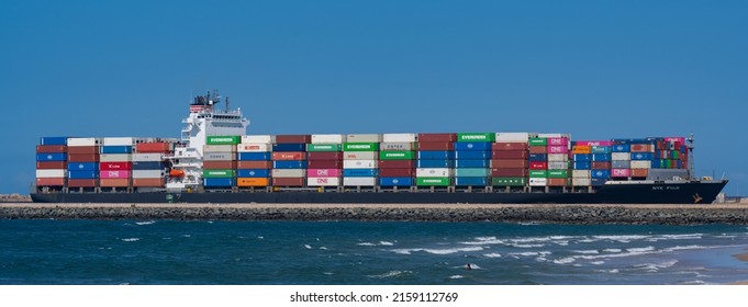Durban, South Africa, February 23, 2022: Container ship from the shipping company NYK FUJI with various containers entering the port of Durban on the Indian Ocean South Africa