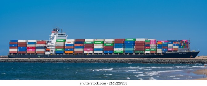 Durban, South Africa, February 23, 2022: Container ship from the shipping company NYK FUJI with various containers entering the port of Durban on the Indian Ocean South Africa