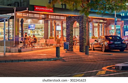 DURBAN, SOUTH AFRICA - JANUARY 26, 2015: Restaurant And People In Umhlanga Rocks Village At Night