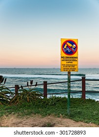 DURBAN, SOUTH AFRICA - JULY 30, 2015: No Swimming Sign Along The Promenade At The Beach In Umhlanga Rocks