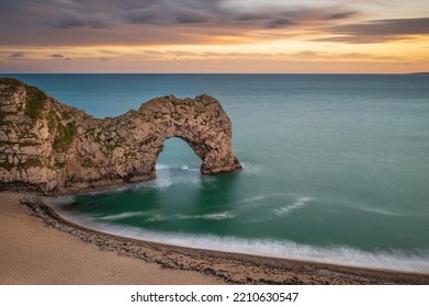 Durdle Door. Famous Coastal Geological Feature On England's Jurassic Coast, In Dorset.  It Is A Sunny Day.