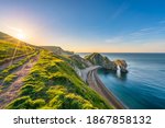 Durdle Door at sunrise in Dorset, Jurassic Coast, England, UK