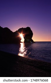 Durdle Door Sunrise Through Arch