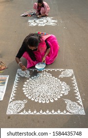 Durgapur, West Bengal / India - December 08,2019.  An Unidentified Indian Woman Participate on a Street Alpona/ Art Competition. 