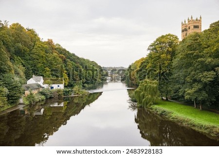 Durham Cathedral and The Old Corn Mill on the banks of the river Wear, with Framwellgate bridge in the distance. City of Durham, England, UK