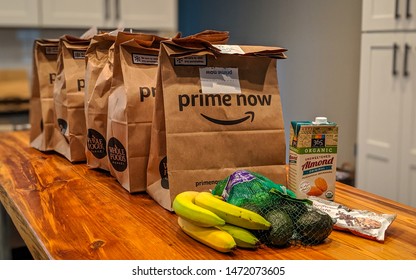 Durham, North Carolina - August 5, 2019: Brown Bags Containing Fresh Produce And Groceries From Whole Foods Delivered To A Shopper's Home Via The Free Two-hour Delivery Service By Amazon Prime Now.