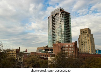 DURHAM, NORTH CAROLINA, USA - MARCH 17, 2018: Downtown Durham buildings including the Hill Building, now 21c Museum Hotel, and One City Center, currently under construction.