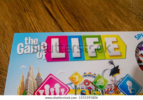 Durham, UK - 10 November 2019: Game of Life by\
Hasbro Gaming. Board game were players choose important life\
decisions about pets, children and family, college career and jobs.\
Life choice concept