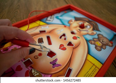 Durham, UK - 20th July 2019: Operation Hasbro Board Game. Gameplay Requires Players To Remove These Plastic Ailments With A Pair Of Tweezers. Medical NHS Doctor Nurse Heart Operation Concept