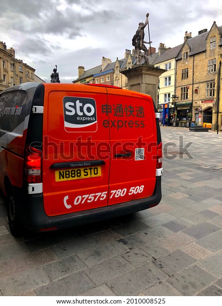 DURHAM, UK - July 05, 2019: An STO Express van seen in\
Durham during graduation when many students prepare to leave the\
city. STO Express is a Chinese logistics company with small\
operations in the UK