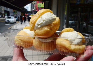 Durian Cream Puff Or Choux Cream In Woman Hand