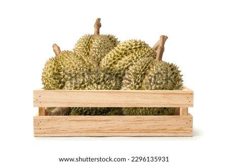 Durian fruits in wooden crate isolate on white background. Clipping path.