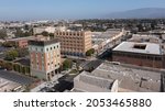 During a break in the fog, afternoon sunlight shines on the historic city center of downtown Salinas, California, USA.