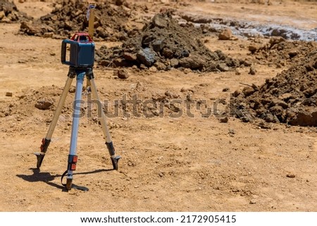 During a construction trench for a concrete foundation , the contractor uses rotary laser leveling equipment for measurement