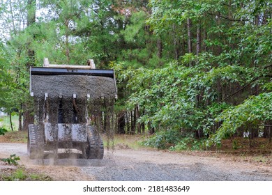 During The Course Of Rehabilitating An Old Road, This Bobcat Loader Tractor Moved And Unloaded Gravel Soft Focus