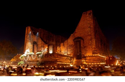 During The Evening Time At A Temple In Ayutthaya. People Come To Walk Around The Church With Candles. To Remember The Buddha By Walking On The Right Side Of The Church