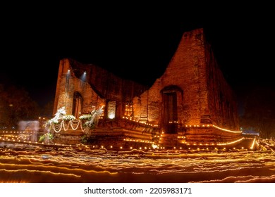 During The Evening Time At A Temple In Ayutthaya. People Come To Walk Around The Church With Candles. To Remember The Buddha By Walking On The Right Side Of The Church