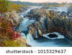 During the fall season Great Falls displays beautiful colors along the ripaians boundaries of the Potomac River near Washington DC. This view is from an overlook at Great Falls Park, VA