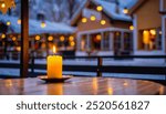 During the winter, a candle is lit at an outside restaurant table; the scene is cozy and has selective focus and bokeh. Wintertime, warm atmosphere, bokeh, selective focus