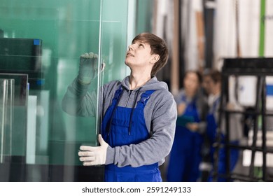 During work process, guy employee produces blanks for repairs and interior decoration. He carries out installation work, products for renovation of residential premises made of glass and plastic.